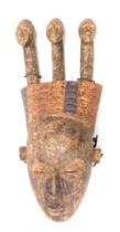 A Koulango three headed divination ancestors mask, Cote D'Ivoire, approx 70 years old, 72cm high.