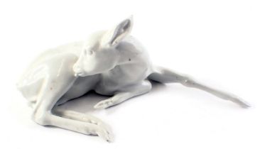 A Wallendorf ceramic foal, seated with blue stamps to underside, 18cm wide.