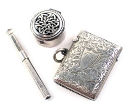 Three items of small silver, comprising a George V silver match case, with floral engrave decoration