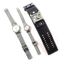 Three wristwatches, comprising a his and hers Skagen of Denmark ultra slim wristwatch with stainless
