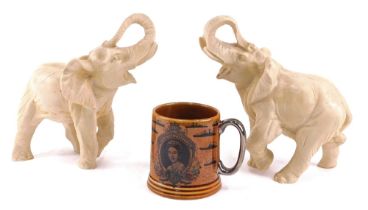 Two resin moulded elephants, 16cm high, and a Lord Nelson mug.