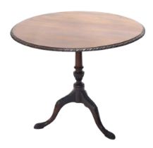 A 19thC walnut occasional table, the circular top with a carved border, on a turned column, tripod b