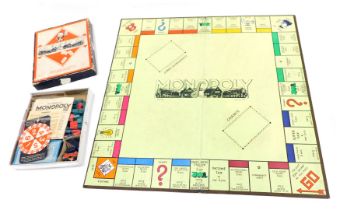 A John Waddington Limited Monopoly set, with card number spinner, card tokens of a car, a boat, etc.