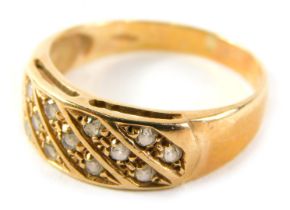 A 9ct gold half hoop dress ring, of five panelled design set with arrangement of thirteen round bril