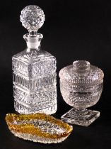 A 19thC cut glass bonbonniere, on a square base, 14cm high, a cut glass decanter and stopper, 28cm h
