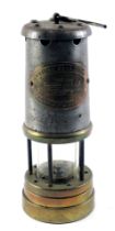 A British Coal Mining Company mining lamp, serial number 88656, 22cm high.
