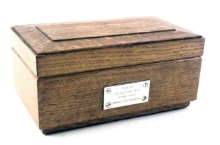 A 1950s oak cigarette box, made of 13thC oak taken from Lincoln Cathedral, the interior with plaque