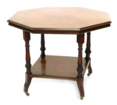 A late Victorian walnut library table, the octagonal top with a moulded edge, on part reeded carved