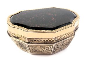 A19thC French silver gilt and yellow metal snuff box, the cartouche shaped lid inset with a bloodsto