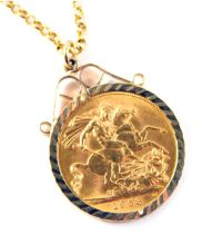 An Elizabeth II full gold sovereign pendant dated 1958, in a 9ct gold pendant mount, on 9ct gold fin