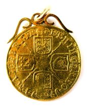 A Queen Anne 1714 gold guinea, attached with 9ct pendant mount, 9g overall.