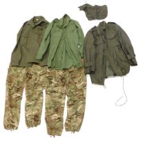 Army clothing, comprising green military jacket, two green military shirts, and a pair of camouflage