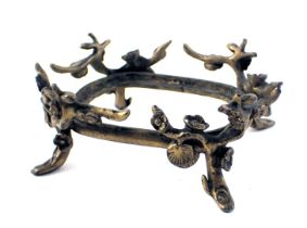 A 19thC gilt metal bronzed effect gilded pot base, of vine and scroll decoration, 4cm high, 12cm wid