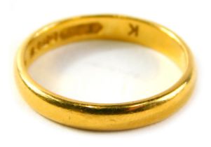 A 22ct gold wedding band, of plain design, ring size Q½, 4.4g.