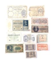 A quantity of Reichsbank military issue banknotes, to include 10000 Reichsmarks, one shilling, milit