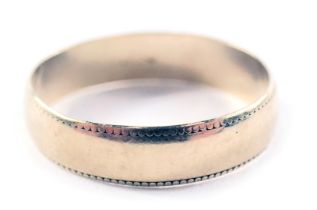 A 9ct gold wedding band, with beaded border, ring size P½, 2g all in.