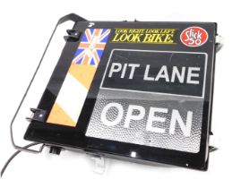 A wall mounting motor racing PIT LANE illuminated sign, applied with various stickers, to include Lo