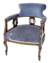 An Edwardian mahogany tub chair, with padded back and seat, on cabriole legs.