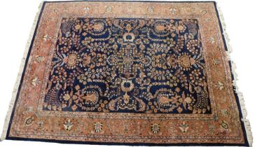 An Indian Serapi design wool rug, decorated overall with flowers, medallions, scrolls, etc., in mult
