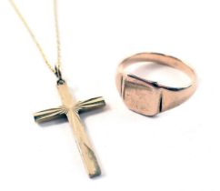A 9ct gold signet ring, with a plain design band, and a 9ct gold crucifix pendant and chain, 5.7g al