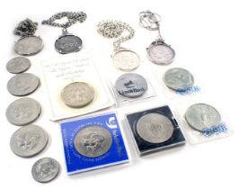 A group of coinage, comprising four silver coin pendants, to include Napoleon III 1868 coin and chai