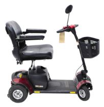 A Go-Go Elite Traveller Plus four wheel mobility scooter, with charger.