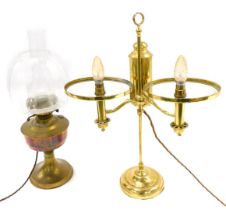 A brass oil lamp, with clear glass chimney, and a table lamp, lacking shades. (2)