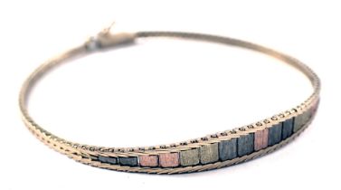 A bi-colour bracelet, the central section of fanned tricolour design, with clip clasp, yellow metal