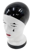 A 20thC German terracotta pottery bust, modelled in the form of a Pierrot, painted in black with red