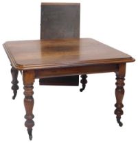 A Victorian mahogany extending dining table, the rectangular top with a moulded edge on turned legs,