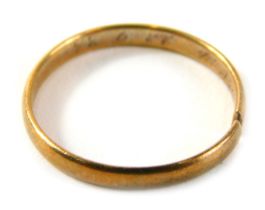 A wedding band, of plain design with internal rubbed inscription cut, yellow metal unmarked, 1.9g al