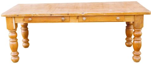 A pine farmhouse table, with a planked top above two frieze drawers, on turned legs, 78cm high, 110c
