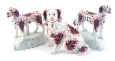 Three Staffordshire Imari pattern dogs, comprising a pair of dogs on oval bases, 12cm high, and a fu