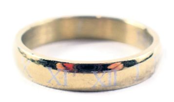 A wedding band, inscribed with Roman numerals, ring size P½, with central inscription 18k.