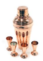 A 1950s Art Deco style copper cocktail set, comprising shaker of tapering form, and four associated
