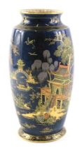 A Carltonware lustre vase, on a blue mottled ground with painted oriental figures and buildings, wit