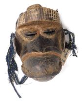 A Kran chief's monkey divination mask, Liberia, approx 75 years old, 28cm high.