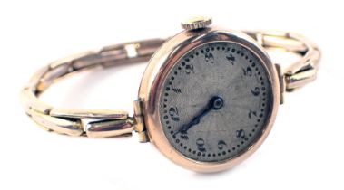 A lady's wristwatch, with a circular silvered coloured dial with blue hands, on expanding bracelet,