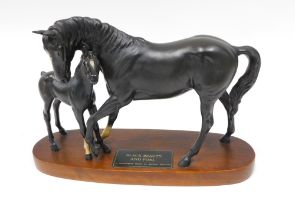 A Beswick Connoisseur model of Black Beauty and a foal, on a shaped base, 30cm wide.