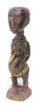 A Koulango maternity figure (protector) Cote D'Ivoire, approx 80 years old, 44cm high.