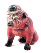 A ceramic painted bulldog figure, painted on red with WWII army hat, inscribed Where's Hitler?, 16cm