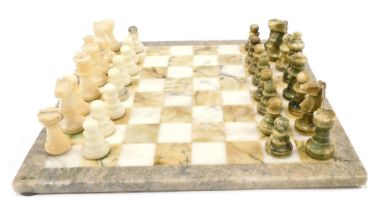 A marble chess set and board, stamped Chiellini, 37cm wide.