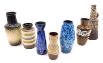A collection of German fat lava vases, mainly in shades of brown and blue, the largest 30cm high.