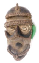 A Bete Nyabwa spider mask, Cote D'Ivoire, approx 60 years old, 37cm high.