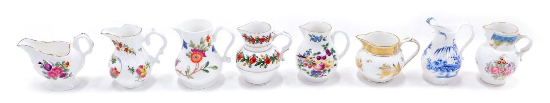 A collection of eight Royal Worcester historic porcelain jugs, with some paperwork.