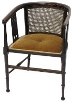 An Edwardian mahogany and boxwood strung tub chair, with a padded seat on turned tapering legs with
