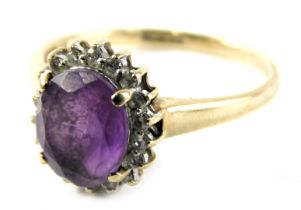 A 9ct gold dress ring, set with opal cut amethyst in four claw setting surrounded by CZs in a floral