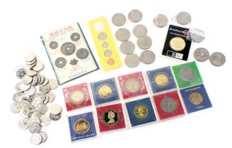 A quantity of commemorative crowns and other coins, to include American 1965 set.