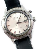 A Seiko chronograph wristwatch, serial number 4D07722, on a silvered dial with outer rim and date ap