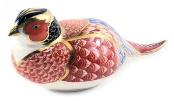 A Royal Crown Derby porcelain pheasant paperweight, signed Julie Towell 1998, gold button, red back